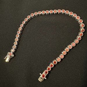 Red tennis bracelet
